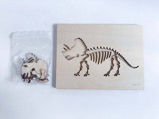 Wooden dinosaur puzzle included in the Digging for Dinosaurs Kit