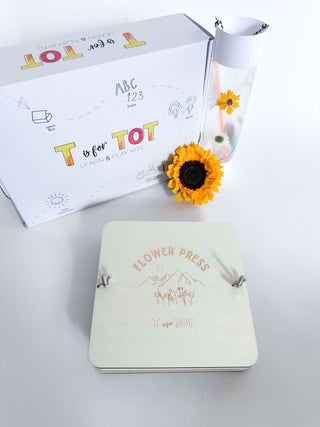 Nature-inspired flower press kit for children. This custom-made press lets kids create their own flower crafts, encouraging imaginative play and creativity. A fun and engaging activity for young explorers.