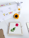 Flower press kit for kids to create personalized crafts. This custom-made press is designed for little nature lovers to collect, press, and create with flowers and leaves. Encourages creativity and outdoor play.