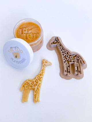 Homemade non-toxic playdough with giraffe cutter.  Early childhood education enhancing fine motor skills.