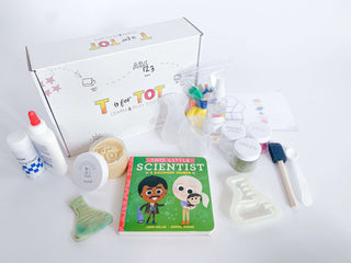 Discovery Kit for kids with homemade playdough, custom flask playdough cutter, and science experiment materials. Includes art project supplies, Little Scientist board book, and a STEAM and recipe card for engaging hands-on activities.