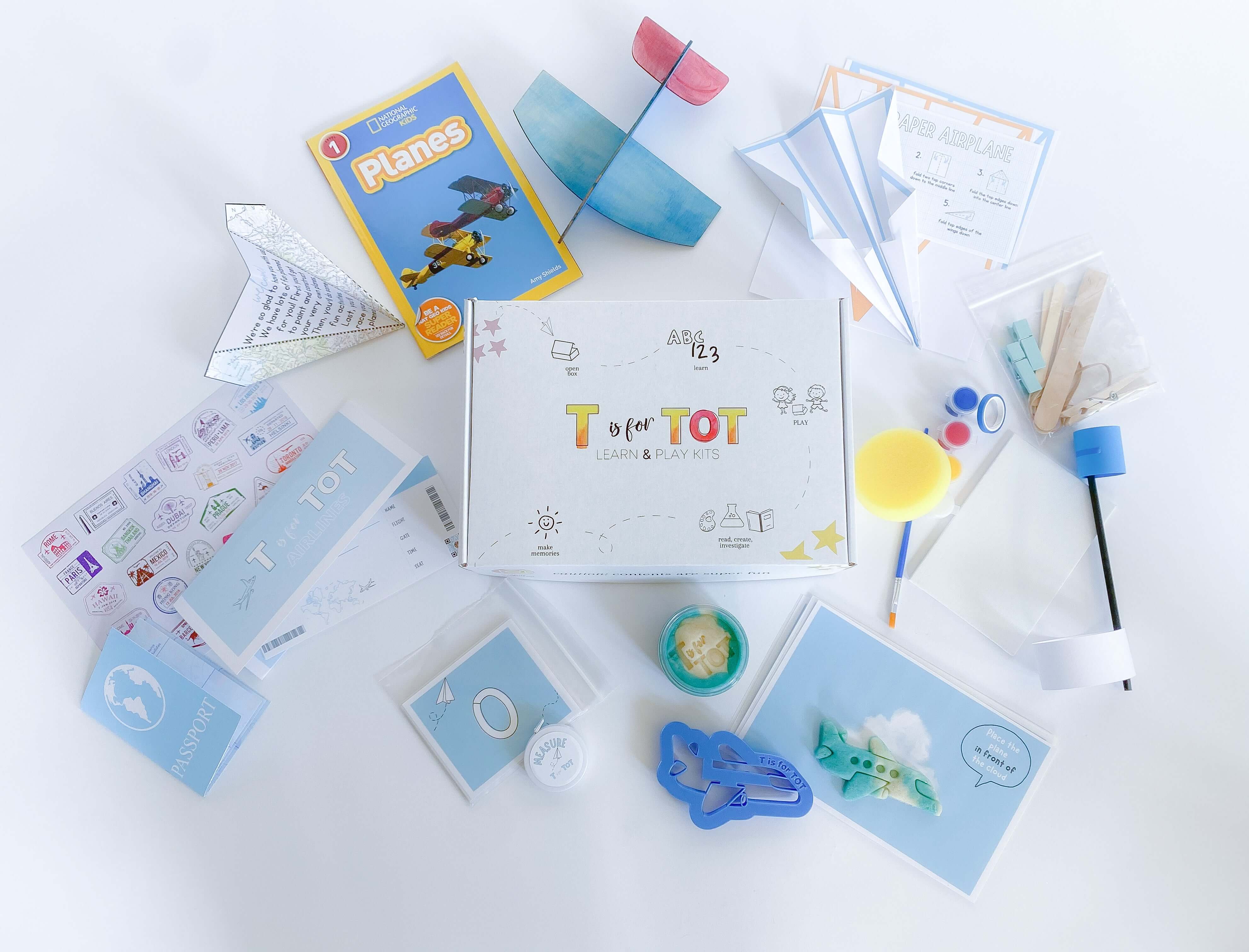 Interactive airplane kit for kids with playdough cutter, homemade playdough, paper airplane materials, wooden airplane crafting, straw airplane set, and pretend play items like pilot license, airplane tickets, and passport with stamp stickers.